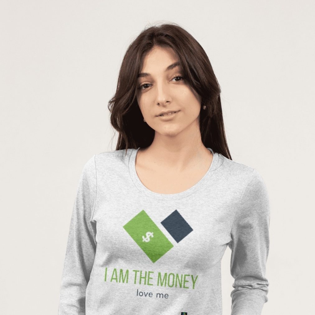 Young woman in a gray long-sleeve shirt with the text "I AM THE MONEY" printed on it.